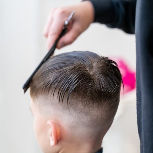 Children's haircuts in the barbershop